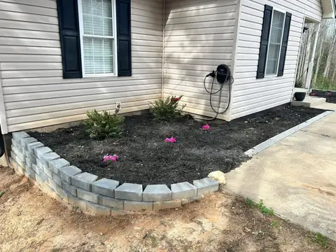Patio area with pavers and landscaping in Monroe, NC.